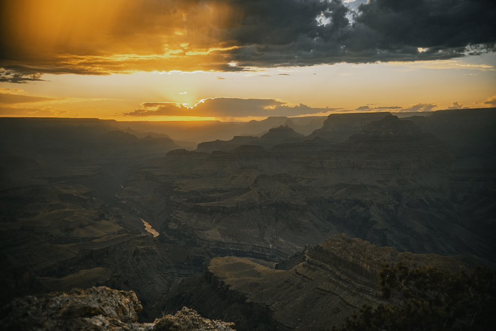 Grand Canyon at sunset beneath dramatic clouds photographed by Rory Duffy