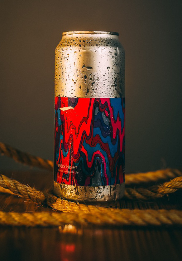 Cold craft beer can with condensation photographed in a warm product setting by Rory Duffy