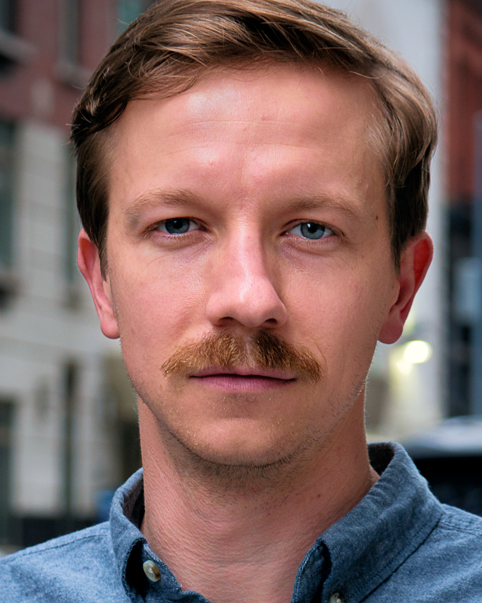 Close editorial portrait of a man photographed by Rory Duffy