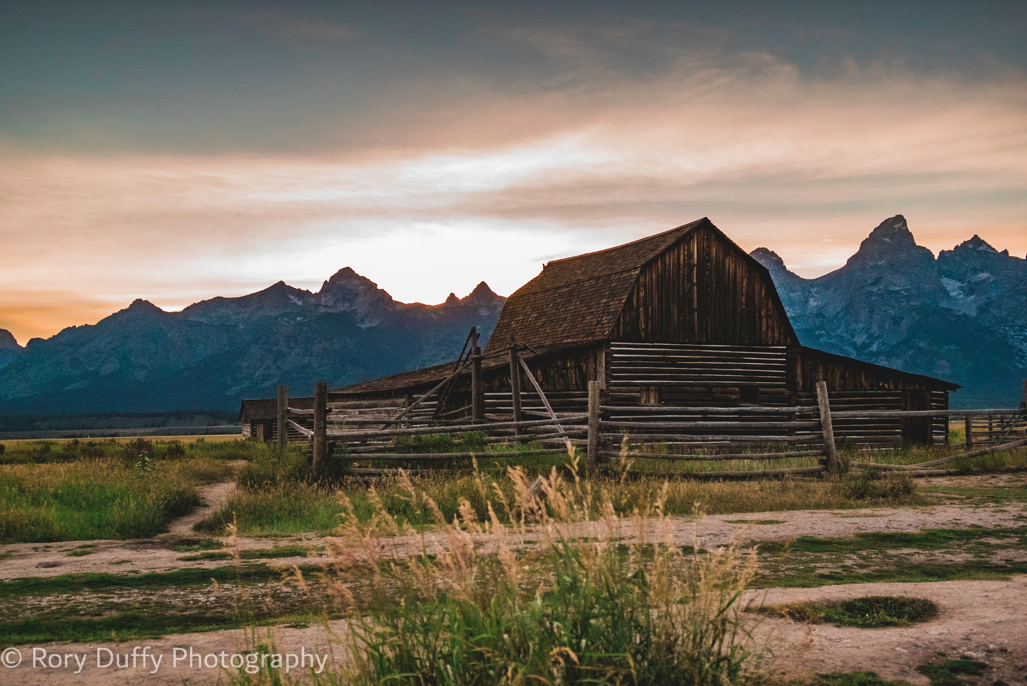 Historic wooden barn beneath the Teton Range photographed by Rory Duffy